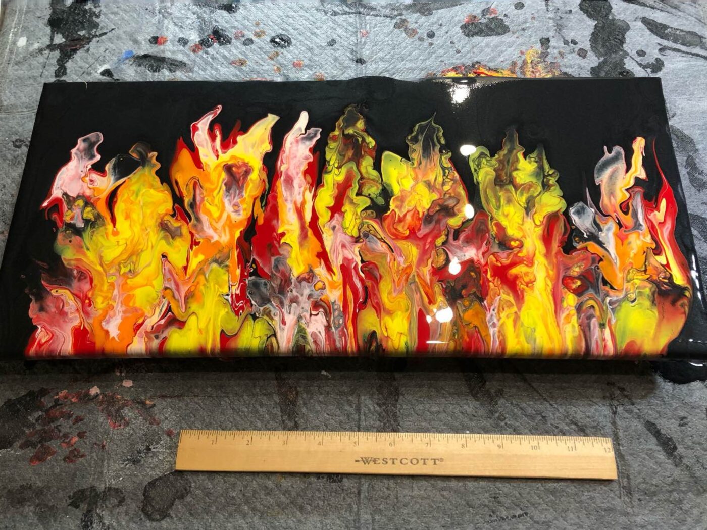 Finished fluid piece with flame-like forms
